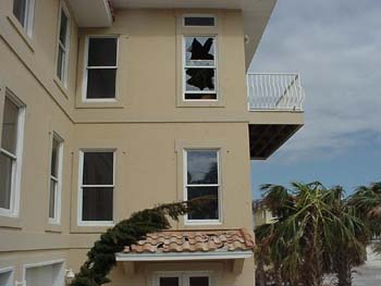 Impact Failure of non-impact window by roof tile (found inside)